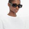 Lunettes de soleil à motif monogramme en noir Lunettes de soleil à motif monogramme en noir