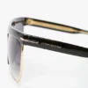 Lunettes de soleil sculptées en métal et acétate avec monture plate