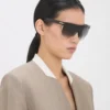 Lunettes de soleil sculptées en métal et acétate avec monture plate